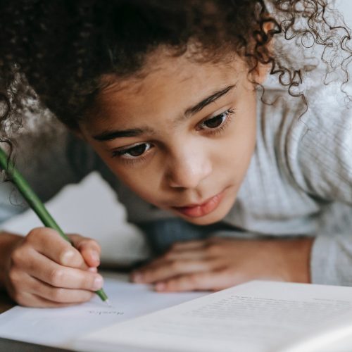 Stock image child tracing letters